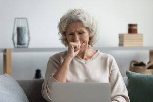 An elderly woman receiving bad news