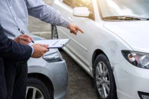 insurance agent drafting car accident report