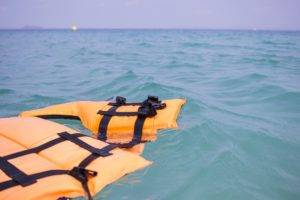 A life vest floating on the water.