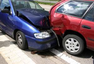blue and red car in an accident