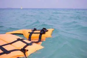 A life vest floating on the water.