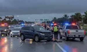 A dramatic Florida car accident scene on a busy highway
