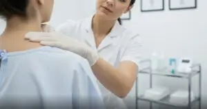 Close-up of a medical examination of neck and shoulders